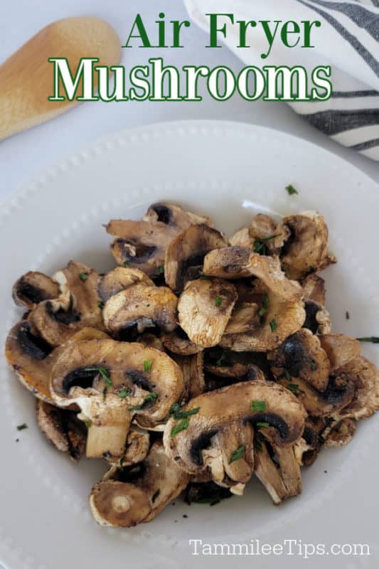 Air fryer mushrooms over a white plate with air fried mushrooms and a wooden spoon