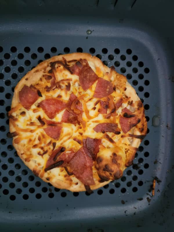 Air fried pepperoni pizza in an air fryer basket