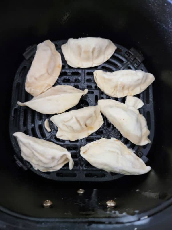 Frozen Dumplings in an air fryer basket