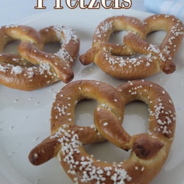 Air Fryer Pretzels text over three pretzels on a white plate