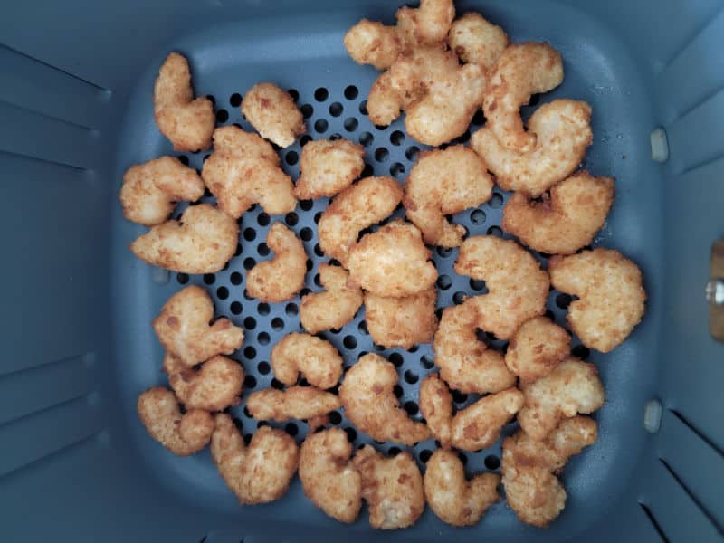 frozen shrimp in an air fryer basket