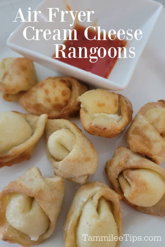 Air fryer cream cheese rangoons over a plate of air fried rangoons and sauce 