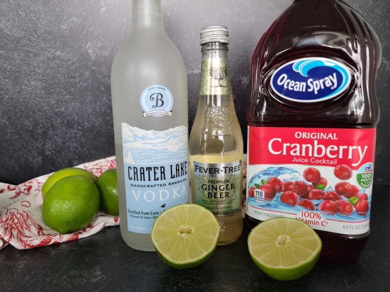 Cranberry Moscow Mule ingredients vodka, ginger beer, cranberry juice, and limes