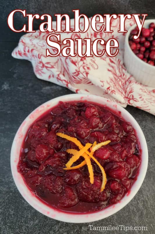 Cranberry Sauce text printed over a white bowl filled with the best cranberry sauce recipe next to a red and white cloth 