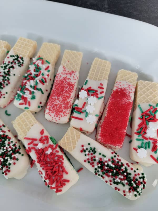 White chocolate dipped wafer cookies covered holiday sprinkles