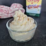 Eggnog Whipped cream swirled in a glass bowl