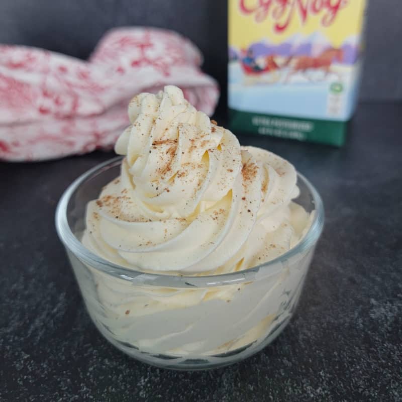 Eggnog Whipped cream swirled in a glass bowl