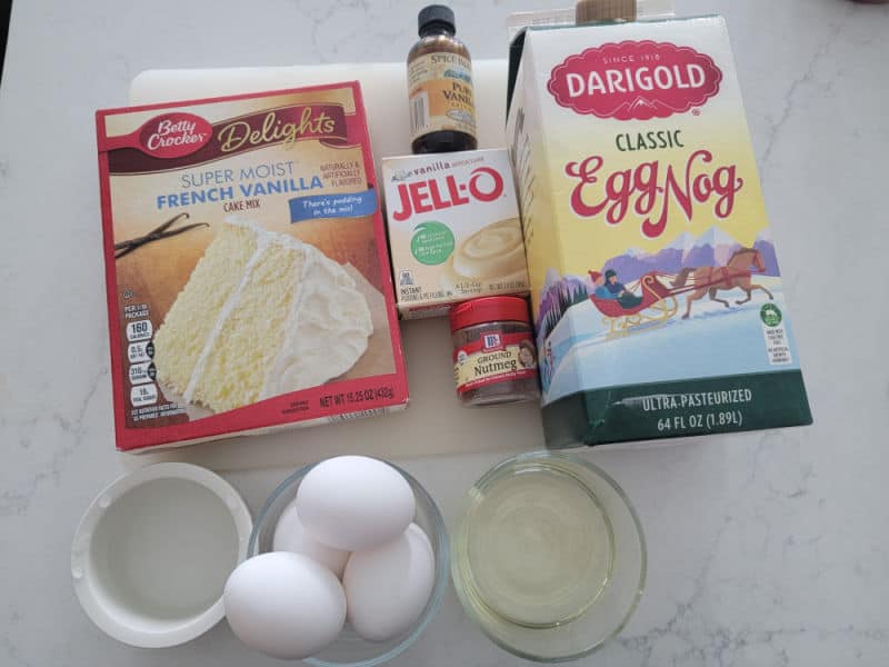 Eggnog Cake Ingredients, French vanilla cake mix, vanilla jello pudding, vanilla extract, eggnog, eggs, and ground nutmeg 