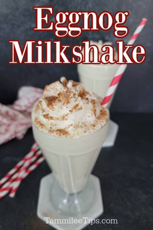 Eggnog Milkshake text written over an old fashioned glass filled with an Eggnog Shake garnished with whipped cream and ground nutmeg with a red striped straw. 