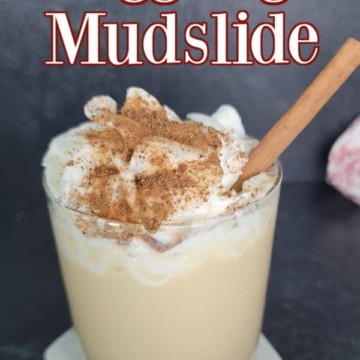 Eggnog Mudslide text over a filled cocktail glass garnished with whipped cream