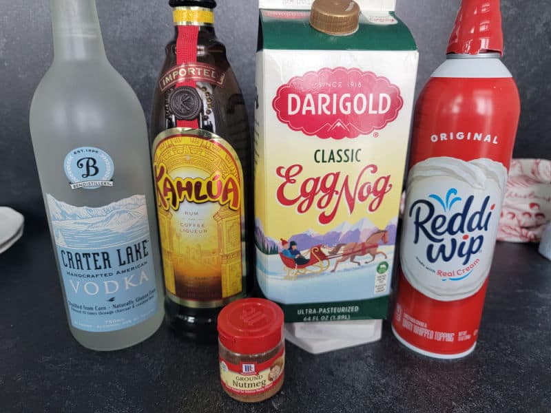 Eggnog Mudslide ingredients, vodka, Kahlua, egg nog, whipped cream, ground nutmeg