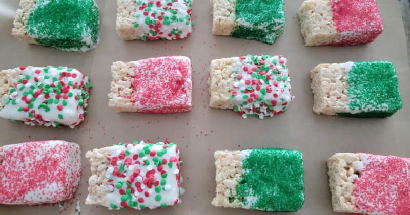 Chocolate covered rice krispie treats covered in holiday sprinkles 