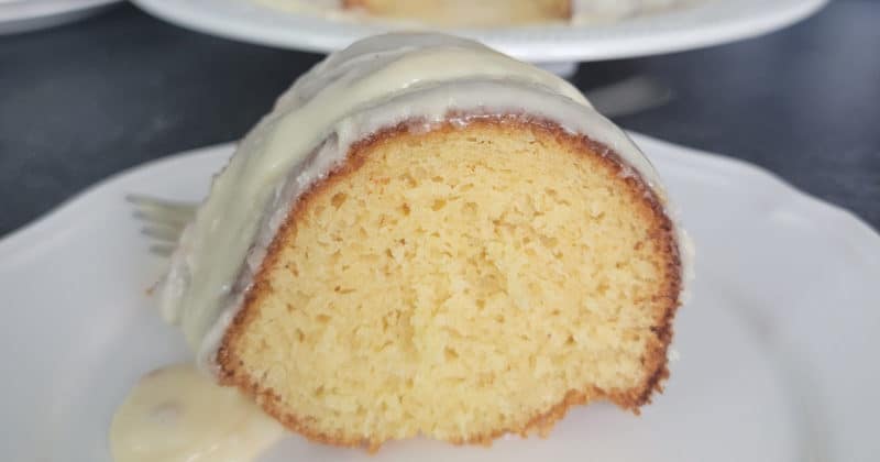 Slice of Eggnog Cake on a white plate