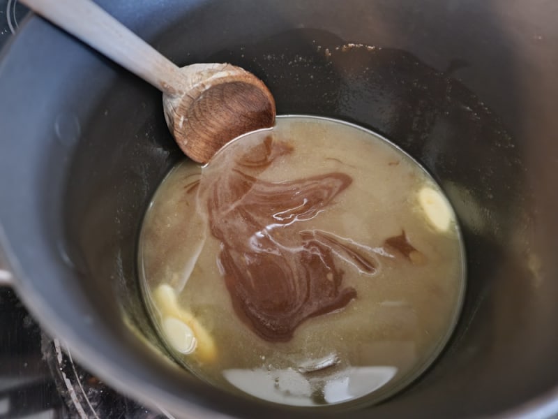 Saucepan with butter and brown sugar to make toffee for Christmas Crack
