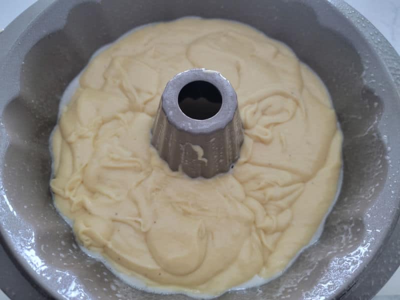 Eggnog cake batter in a Bundt cake pan before baking