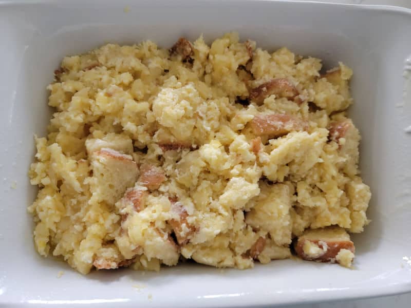 pineapple stuffing in a white baking dish before baking