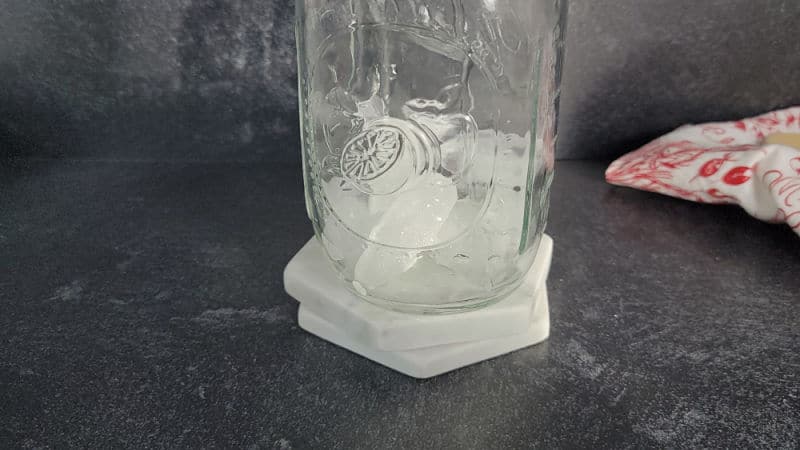 Ice in a mason jar cocktail shaker before making a polar bear shot