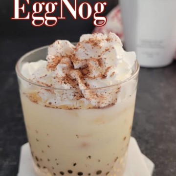 RumChata Eggnog text over a filled cocktail glass garnished with whipped cream
