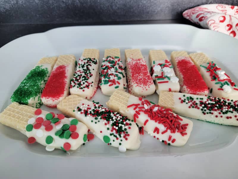 White chocolate dipped wafers coated in holiday sprinkles