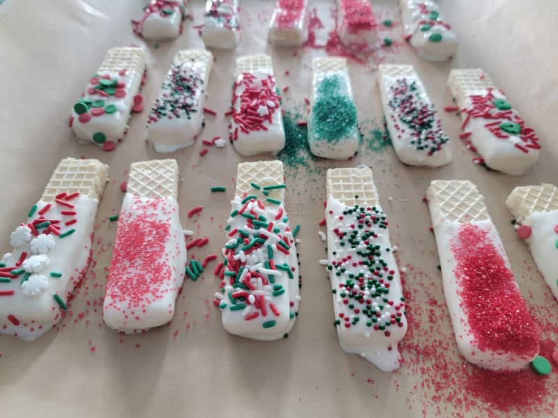 Chocolate dipped wafer coated in holiday sprinkles