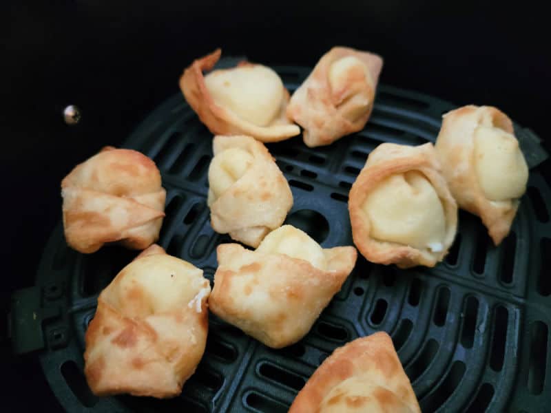 Air fried cream cheese wontons in the air fryer basket