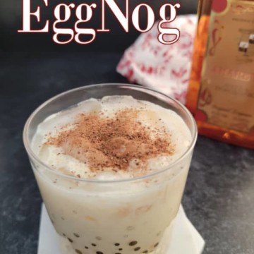 Amaretto Eggnog text over a cocktail glass