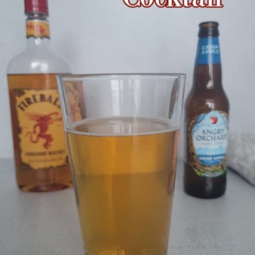 Angry Balls Cocktail text over a cocktail glass, fireball cinnamon whiskey, and hard apple cider
