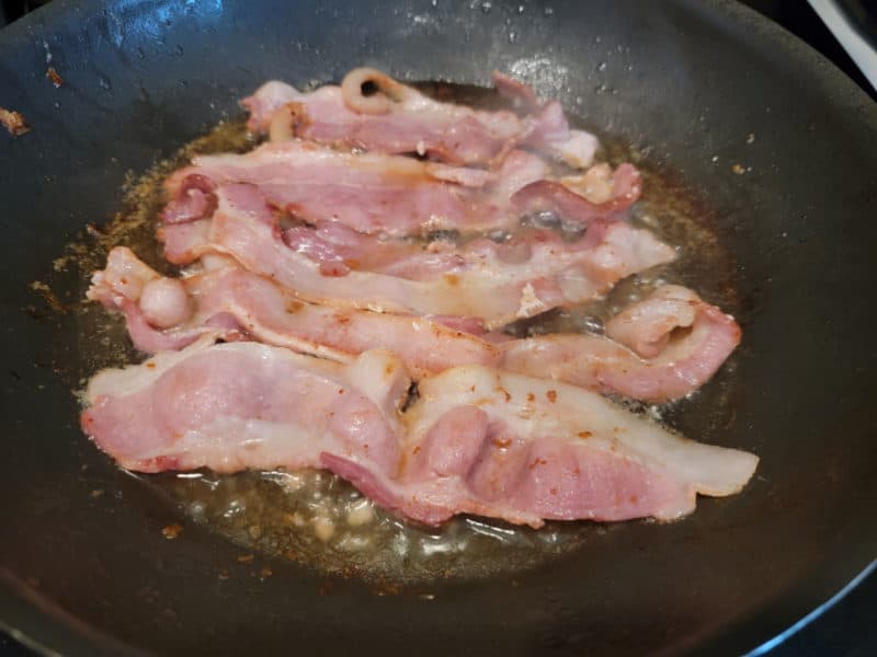 Bacon cooking in a skillet