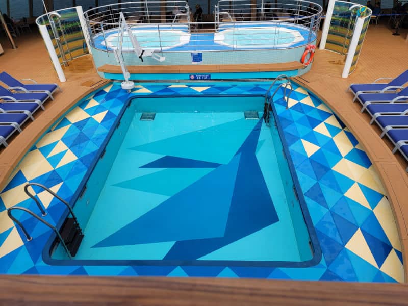 Square pool with geometric designs in it