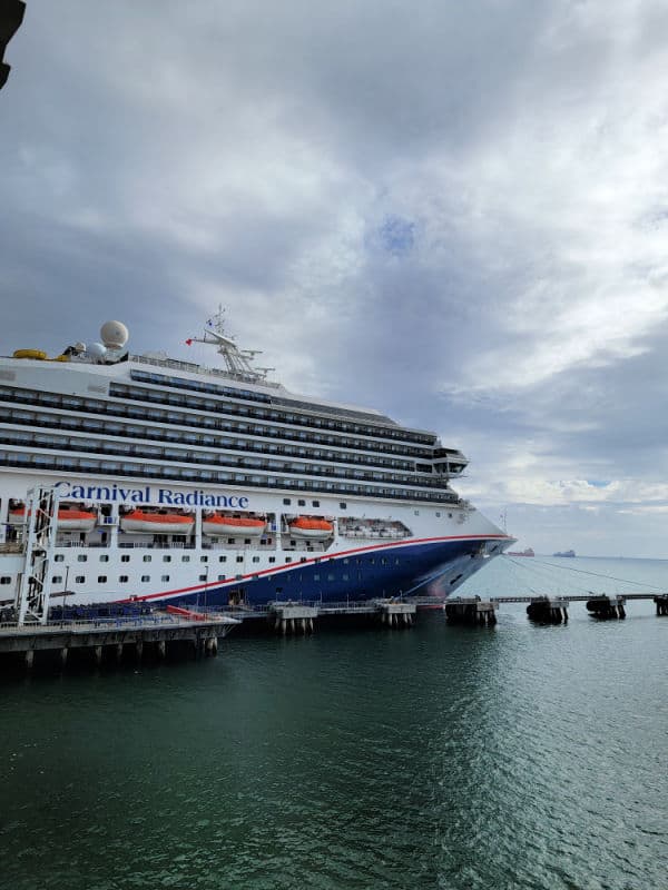 Carnival Radiance cruise ship tied to port