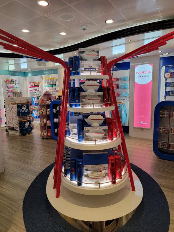 Carnival souvenir gift shot with cruise ship shaped speakers on a display