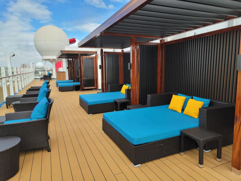 lounge beds and chairs on the cruise deck