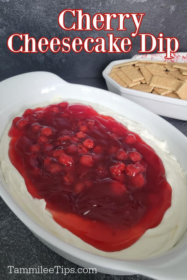 Cherry Cheesecake Dip text over a large casserole dish with cherry cheese cake dip and a bowl of graham crackers