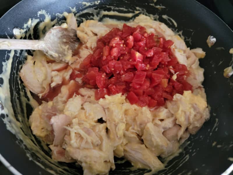 Rotel Diced Tomatoes on top of chicken for rotel chicken spaghetti