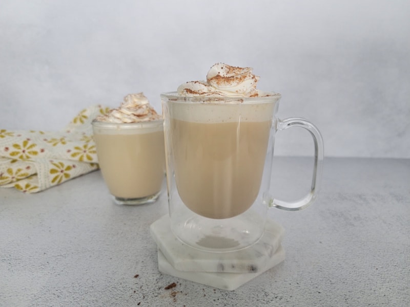2 Eggnog Coffees in clear glass coffee mugs with a cloth napkin