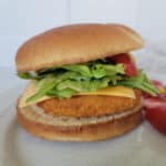 Air fryer chicken patty on a bun with lettuce, cheese and tomato