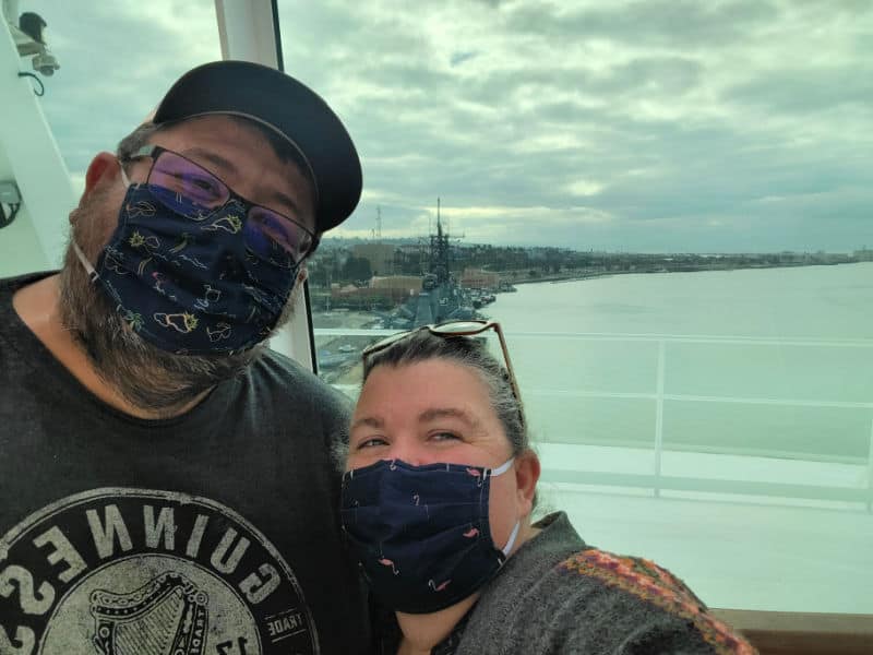 John and Tammilee standing with a view of water behind them. 