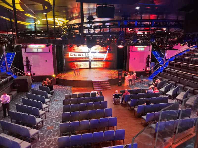 Lounge with chairs lined up and stage lit