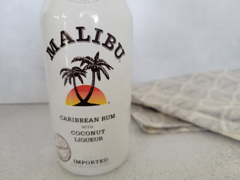 Malibu rum bottle next to a cloth napkin