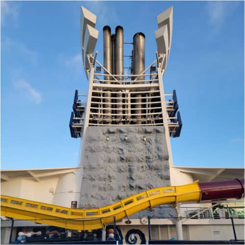 rock climbing wall by a water slide