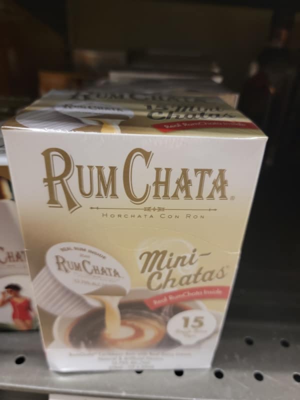 RumChata mini containers in a box on the shelf