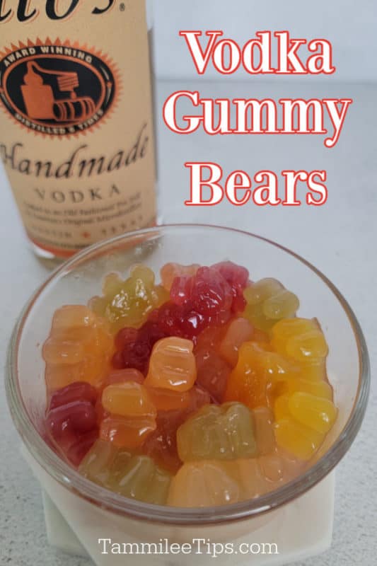 Vodka Gummy Bears over a glass bowl with gummy bears and a bottle of Tito's Vodka