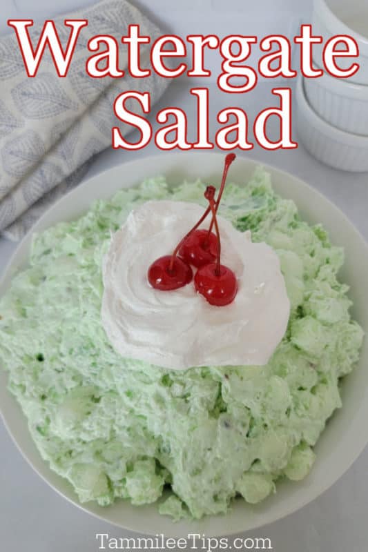 Watergate Salad printed in text over a large bowl with Watergate green salad topped with a dollop of Cool Whip and maraschino cherries