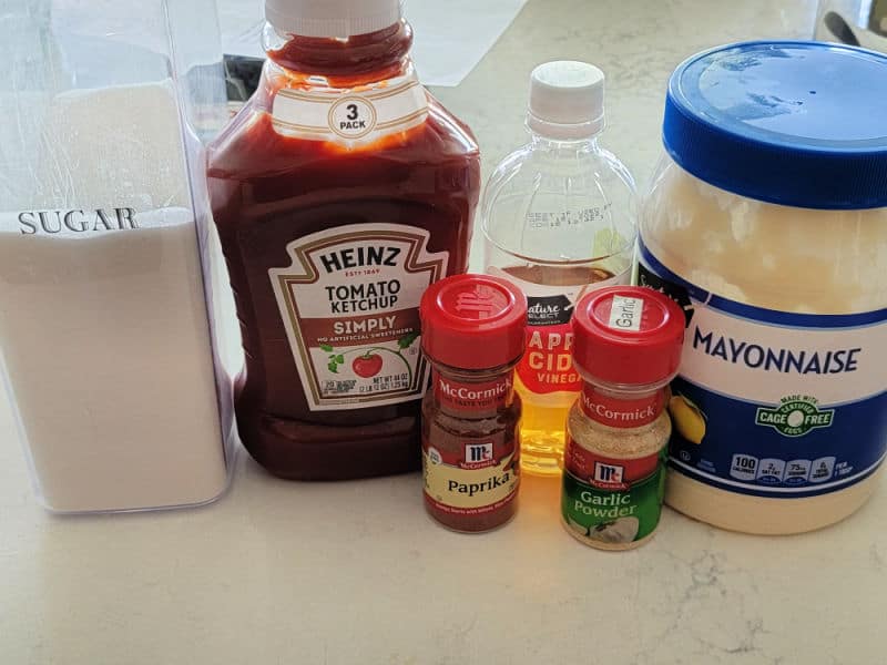 Homemade Yum Yum sauce ingredients, sugar, tomato ketchup, paprika, apple cider vinegar, garlic powder, and mayonnaise