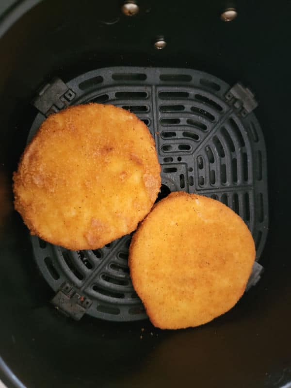 air fried chicken patties in an air fryer basket