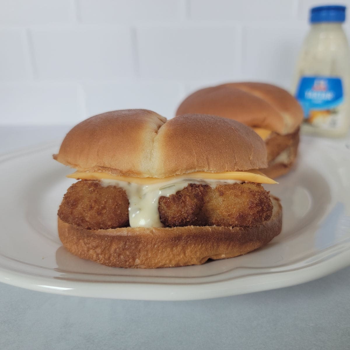air fried fish fillet sandwich on a white plate