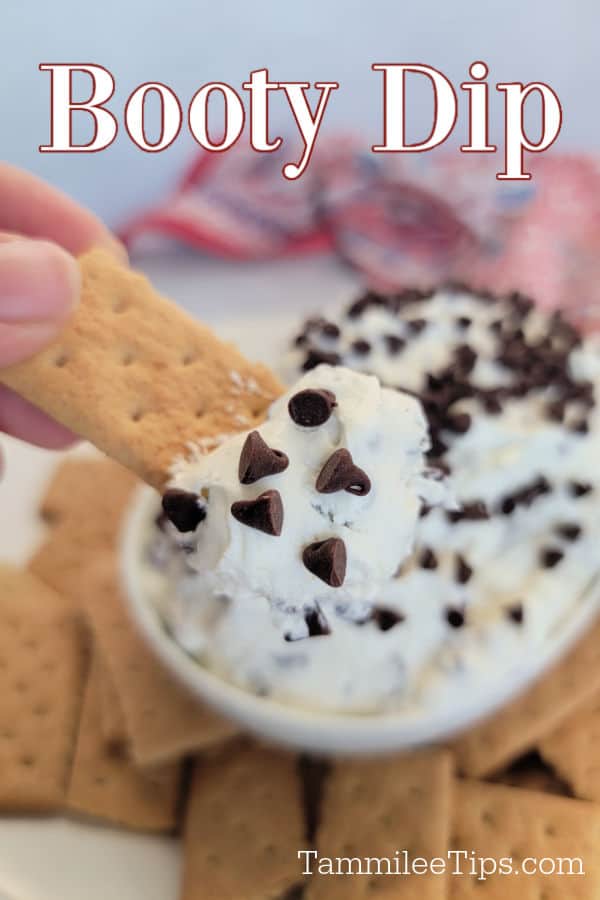 Booty Dip text over a bowl with creamy white dip and chocolate chips next to graham crackers