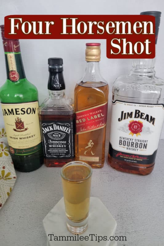 Four Horseman Shot over a filled shot glass and irish whiskey, tennessee whiskey, johnnie walker, and jim beam bottles 