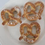 Air fried pretzels with salt on a white plate