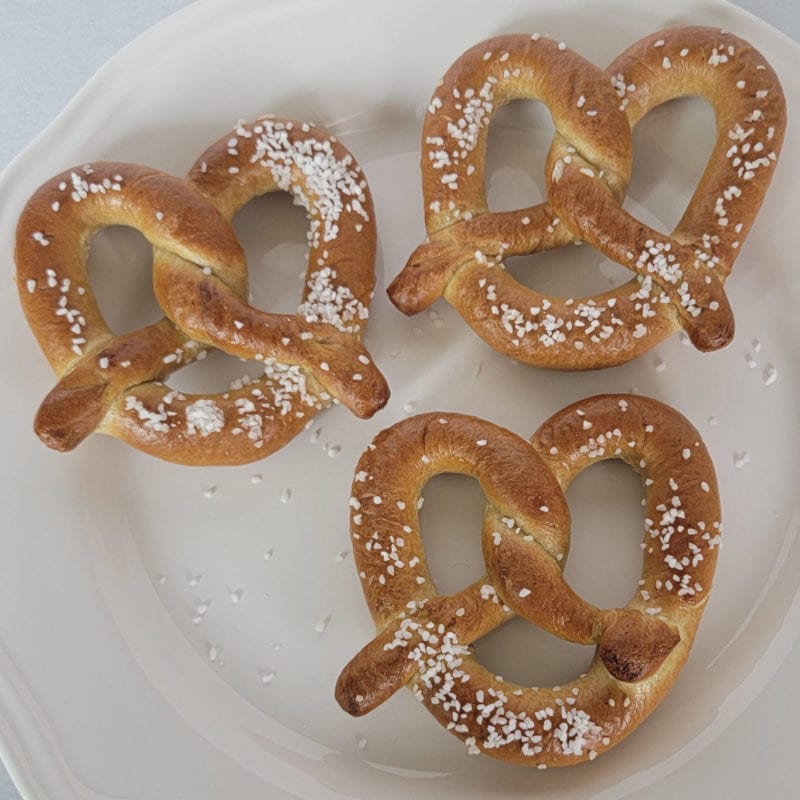 Air fried pretzels with salt on a white plate